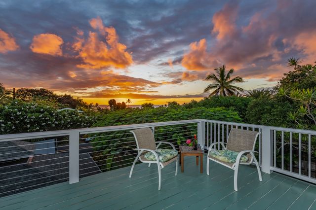 a view of a chairs and table on the wooden floor