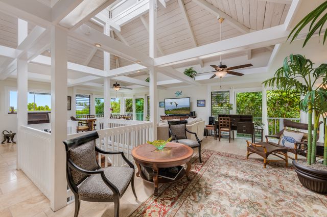 a view of a patio with table and chairs potted plants with wooden floor
