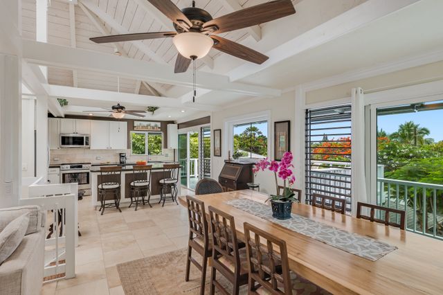 a view of a dining area with furniture window and outside view
