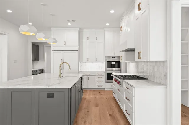 a open kitchen with granite countertop a stove and a sink
