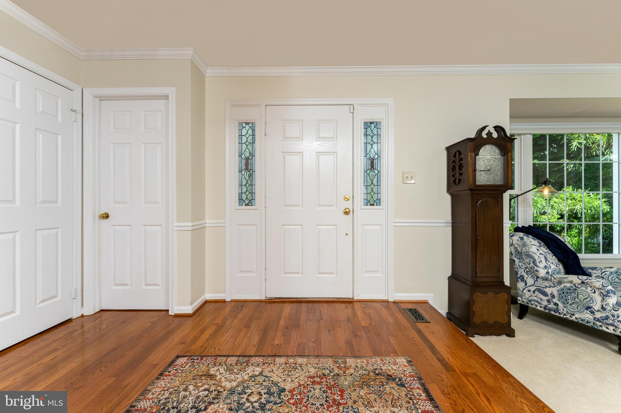 13824 Springstone Drive Clifton, VA 20124 - Photo 2 of 56 a view of a bedroom with wooden floor and stairs