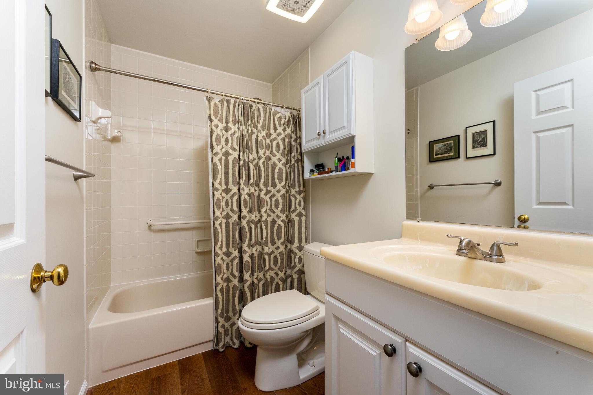 13824 Springstone Drive Clifton, VA 20124 - Photo 23 of 56 a bathroom with a sink toilet and shower