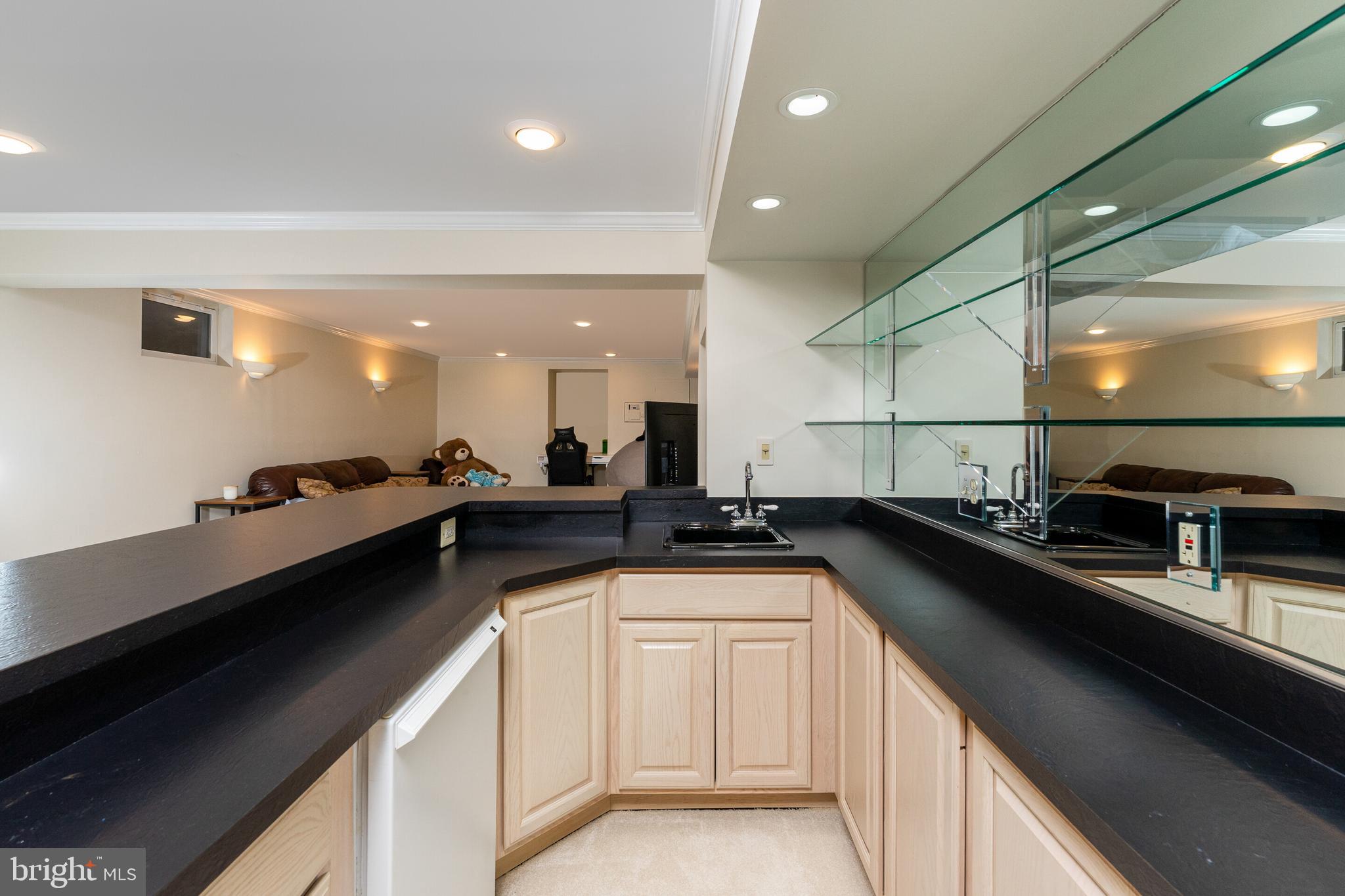 13824 Springstone Drive Clifton, VA 20124 - Photo 26 of 56 a kitchen with a sink and cabinets