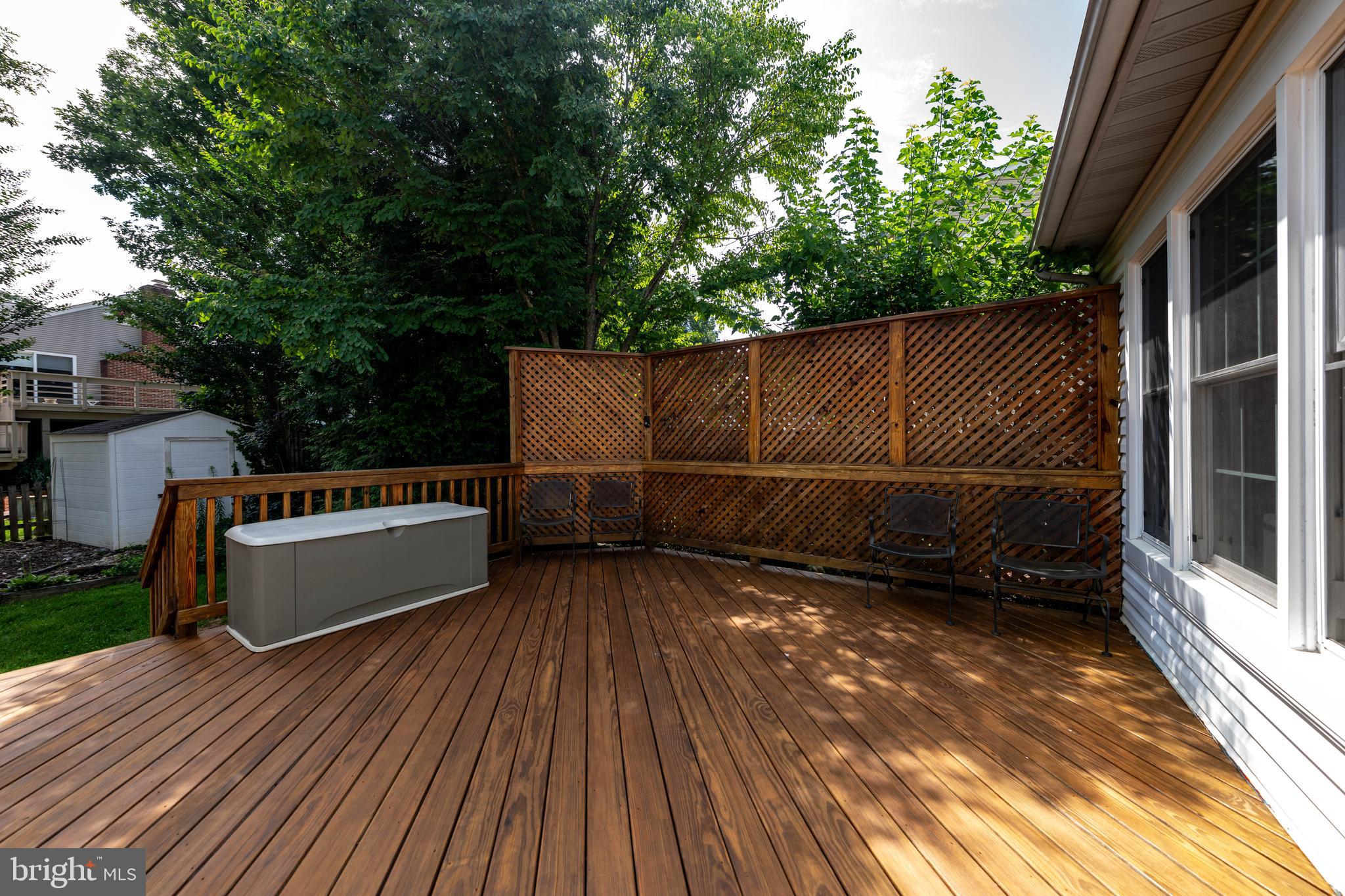 13824 Springstone Drive Clifton, VA 20124 - Photo 38 of 56 a view of a roof deck with wooden floor and fence