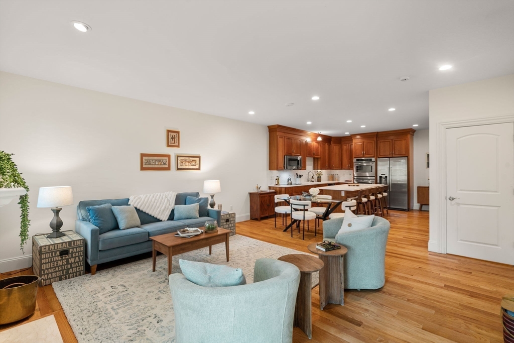 287 Langley Road, Unit 43 Newton, MA 02459 - Photo 15 of 36 a living room with furniture and a wooden floor
