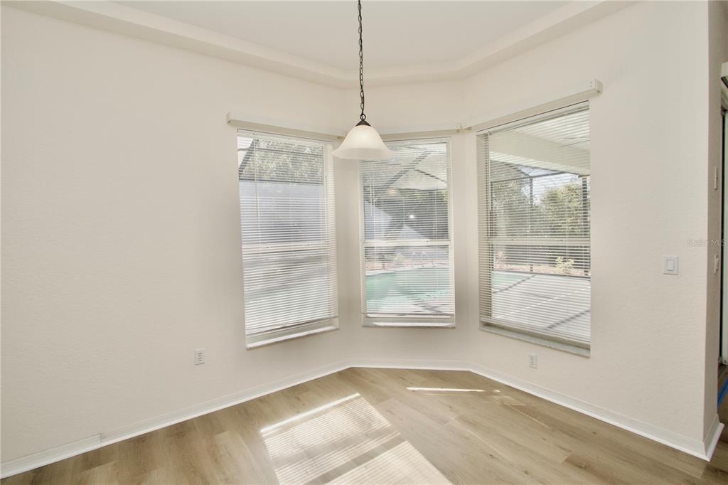 8056 Floral Drive Spring Hill, FL 34607 - Photo 15 of 29 a view of a room with blue walls and a window