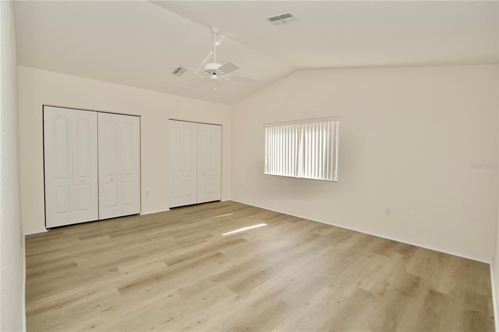 8056 Floral Drive Spring Hill, FL 34607 - Photo 20 of 29 an empty room with windows