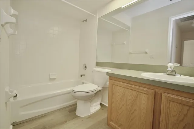 a bathroom with a sink a toilet and a bathtub