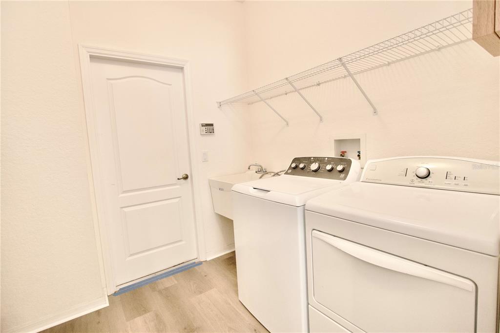 8056 Floral Drive Spring Hill, FL 34607 - Photo 24 of 29 a utility room with dryer and washer