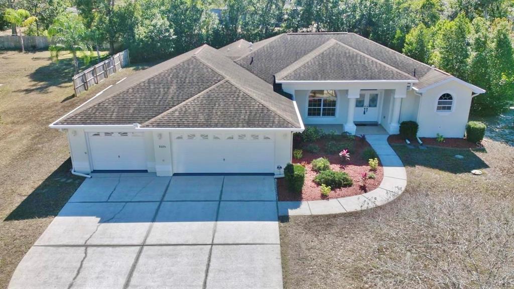8056 Floral Drive Spring Hill, FL 34607 - Photo 3 of 29 a view of a house with a patio