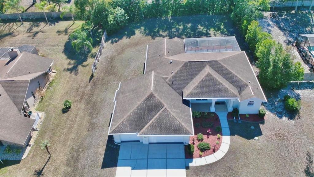 8056 Floral Drive Spring Hill, FL 34607 - Photo 5 of 29 an aerial view of a house with a yard