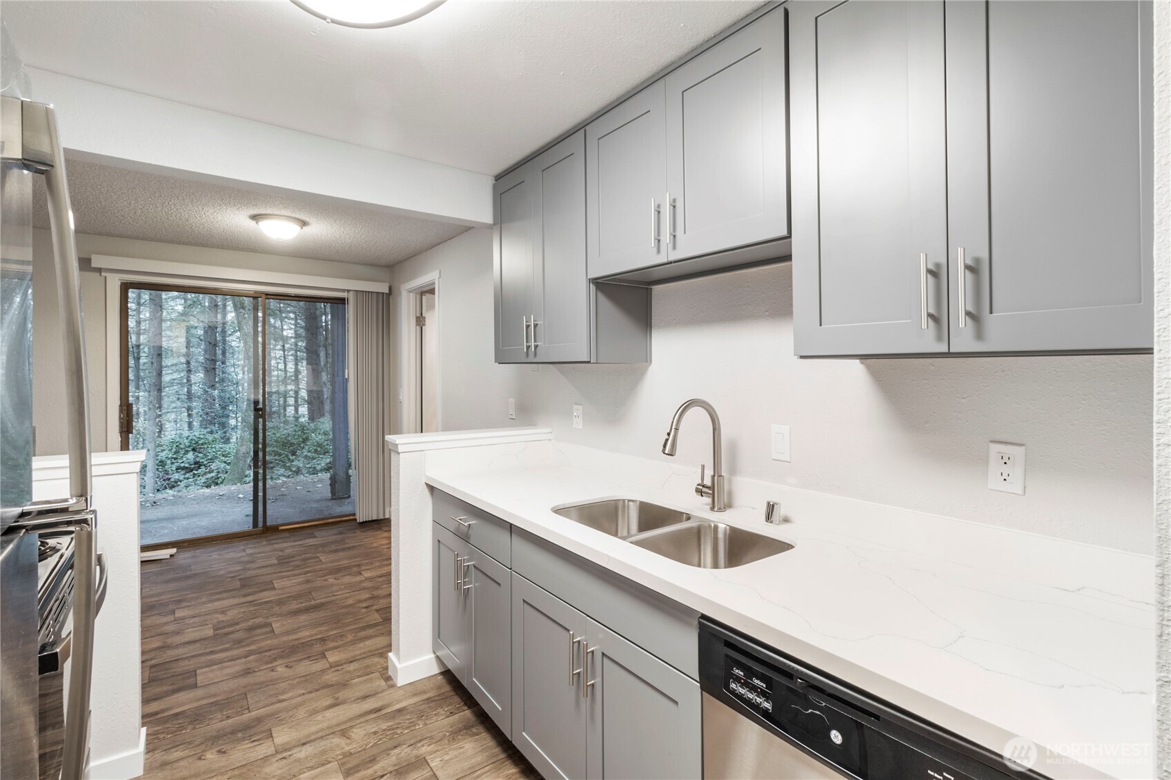 34007 1st Circle South Federal Way, WA 98003 - Photo 10 of 13 a kitchen with stainless steel appliances granite countertop a sink stove and cabinets