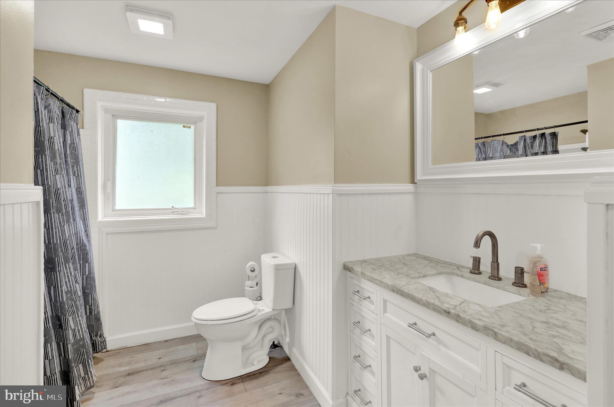434 East Moyer Road Pottstown, PA 19464 - Photo 16 of 38 a bathroom with a granite countertop sink a toilet and a mirror