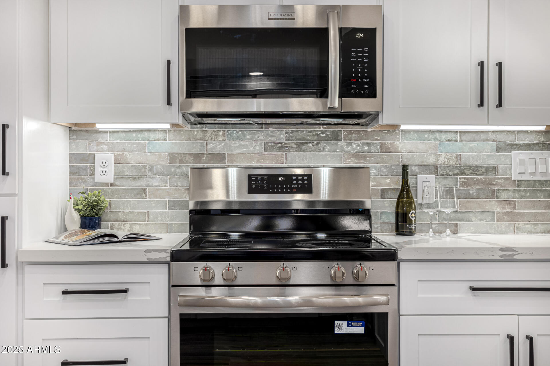 19 East Boca Raton Road Phoenix, AZ 85022 - Photo 18 of 54 a kitchen with stove and microwave