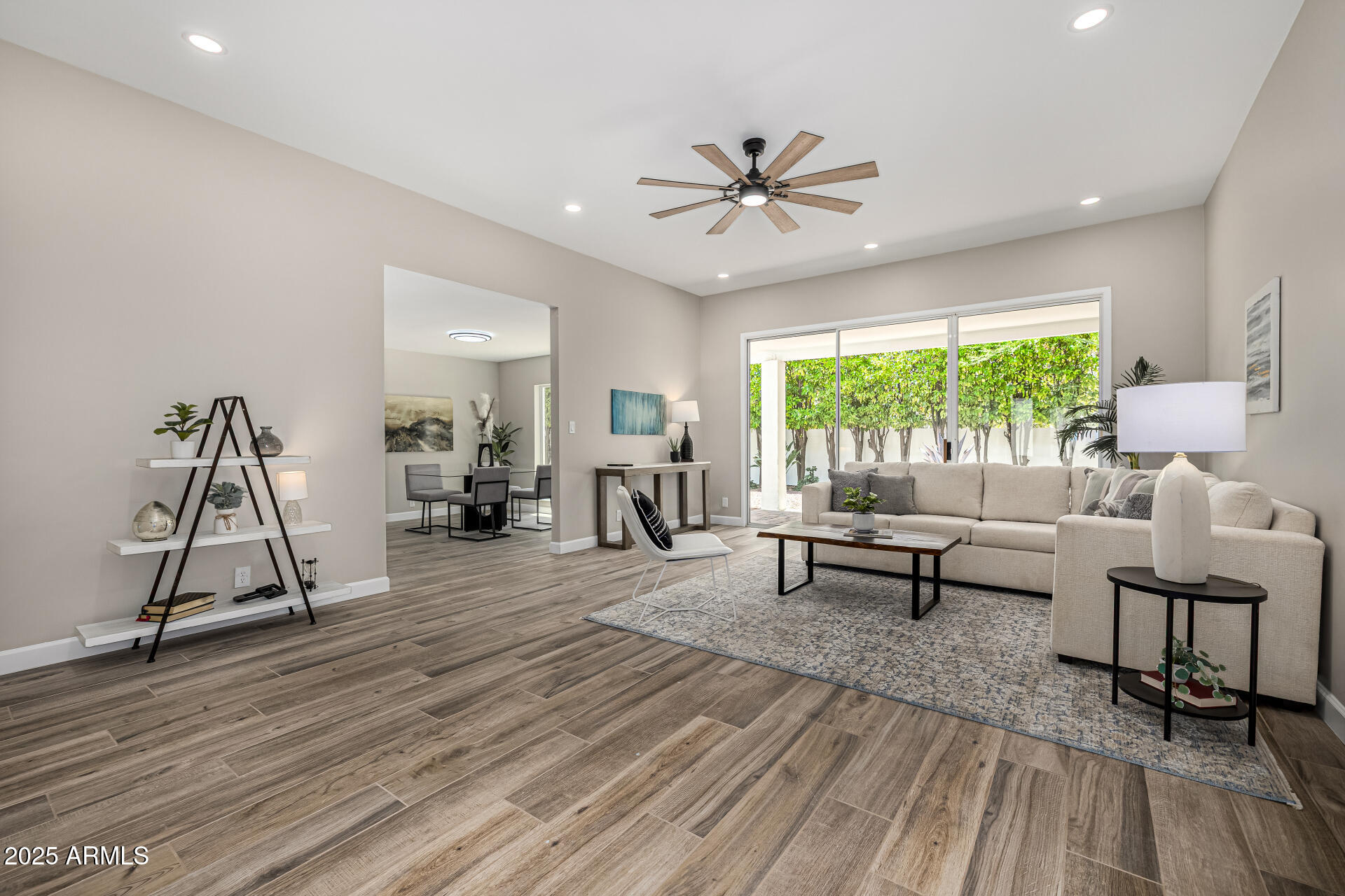 19 East Boca Raton Road Phoenix, AZ 85022 - Photo 21 of 54 a living room with furniture and a floor to ceiling window