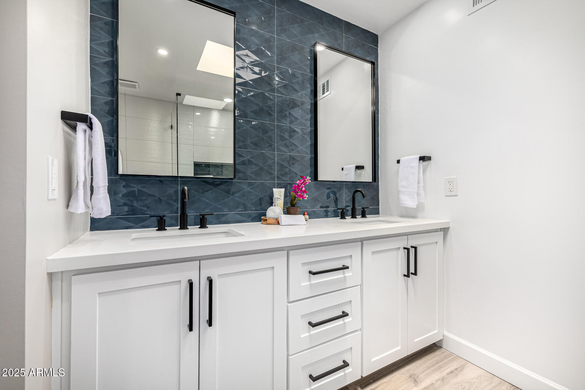 19 East Boca Raton Road Phoenix, AZ 85022 - Photo 36 of 54 a bathroom with a sink and a mirror