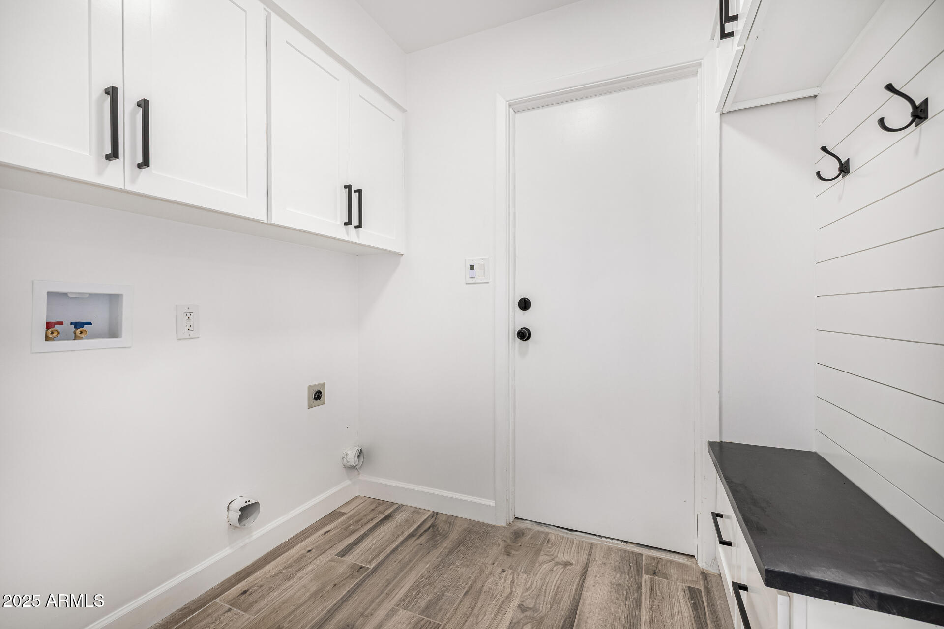 19 East Boca Raton Road Phoenix, AZ 85022 - Photo 41 of 54 a view of a room with racks on the wall