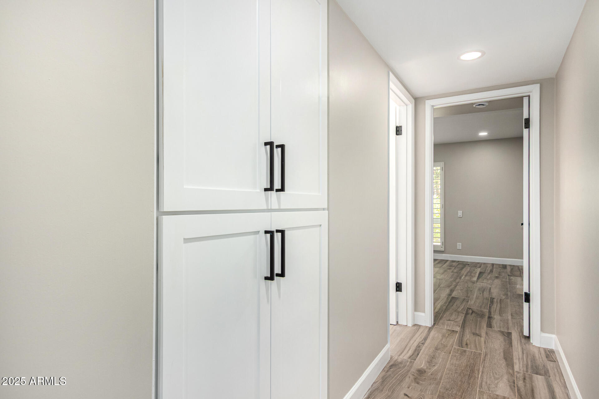 19 East Boca Raton Road Phoenix, AZ 85022 - Photo 42 of 54 a view of a hallway with wooden floor