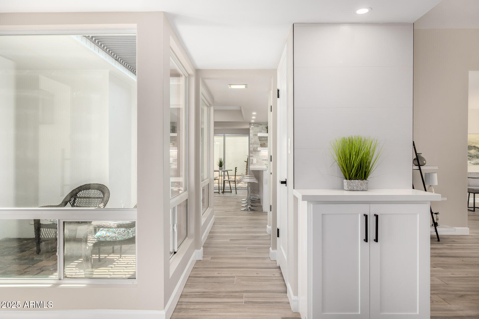 19 East Boca Raton Road Phoenix, AZ 85022 - Photo 9 of 54 a view of a hallway with wooden floor and staircase
