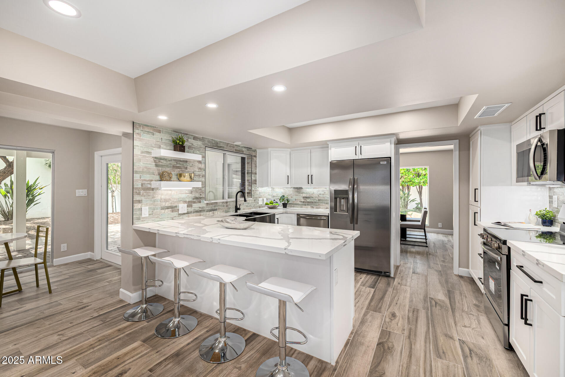 19 East Boca Raton Road Phoenix, AZ 85022 - Photo 10 of 54 a large kitchen with a table and chairs in it