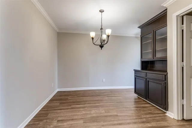 a view of a kitchen with a sink and dishwasher top oven