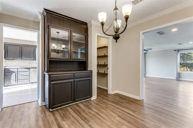 a view of a kitchen from the hallway