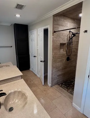 a bathroom with a sink and shower