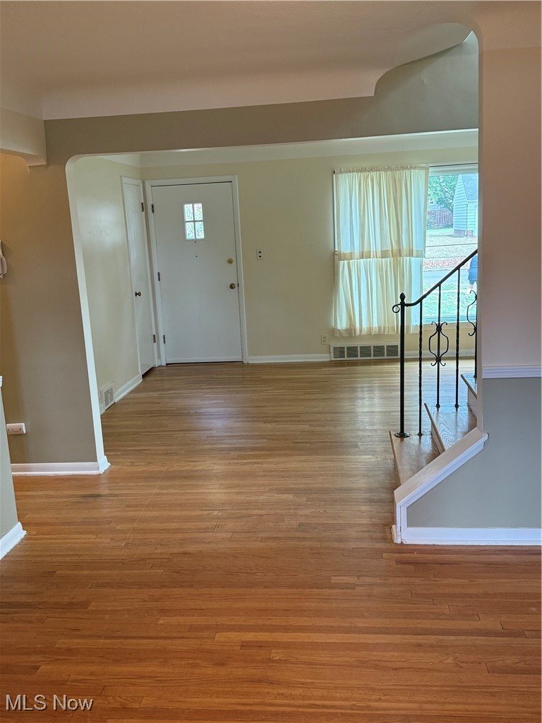 1284 Haverston Road Lyndhurst, OH 44124 - Photo 13 of 43 Foyer featuring arched walkways and light wood finished floors
