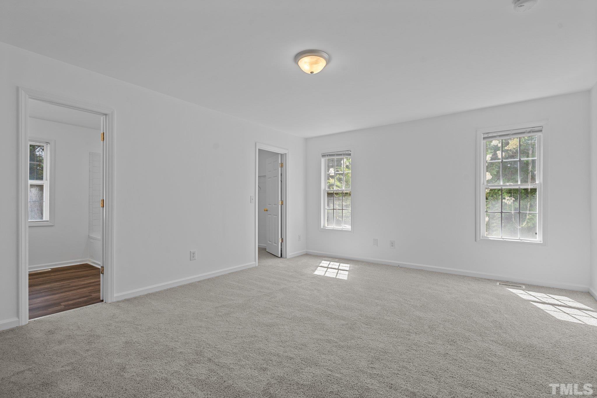 302 Laurel Drive Smithfield, NC 27577 - Photo 20 of 38 a view of an empty room with a window