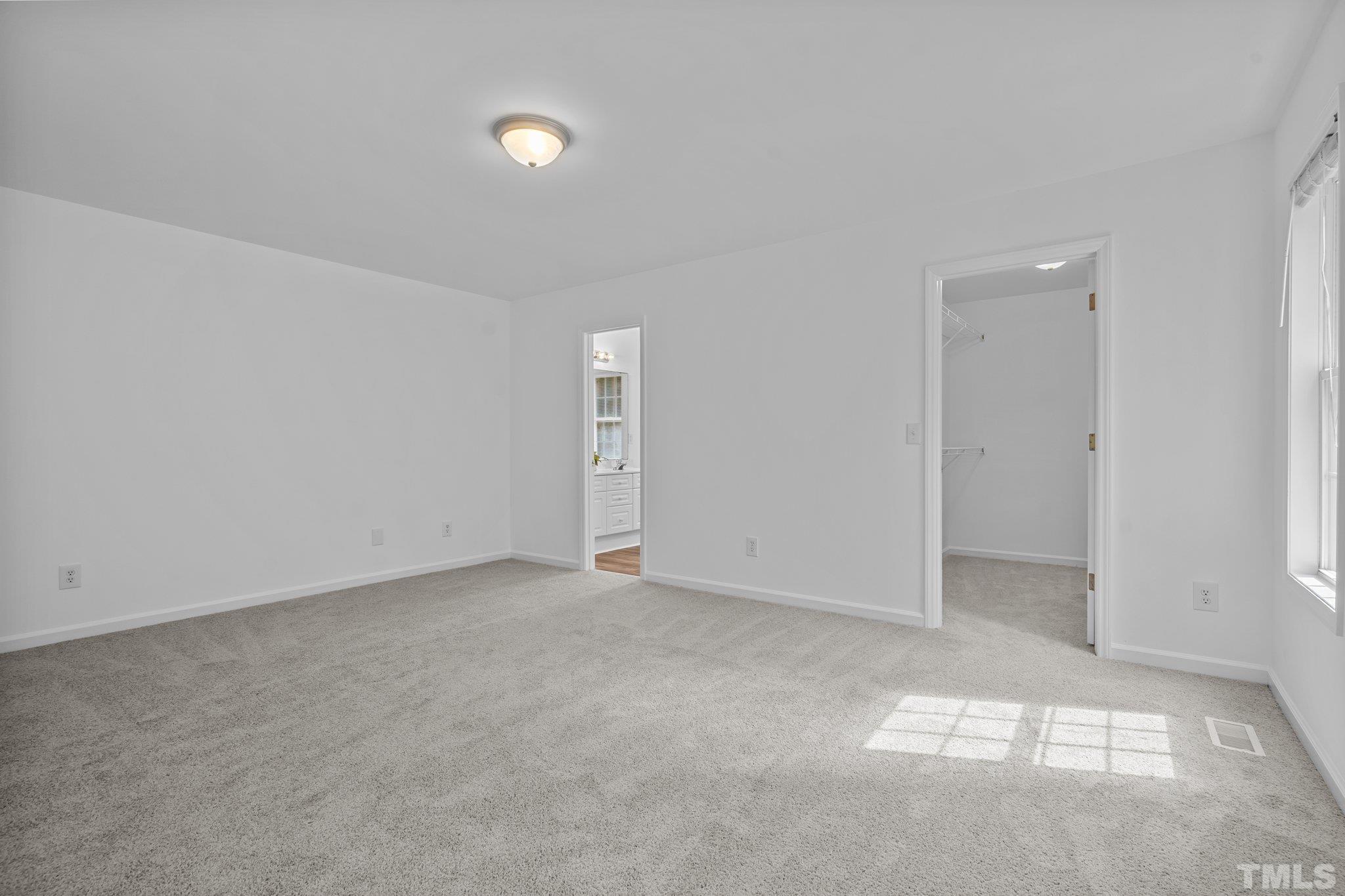 302 Laurel Drive Smithfield, NC 27577 - Photo 21 of 38 an empty room with windows