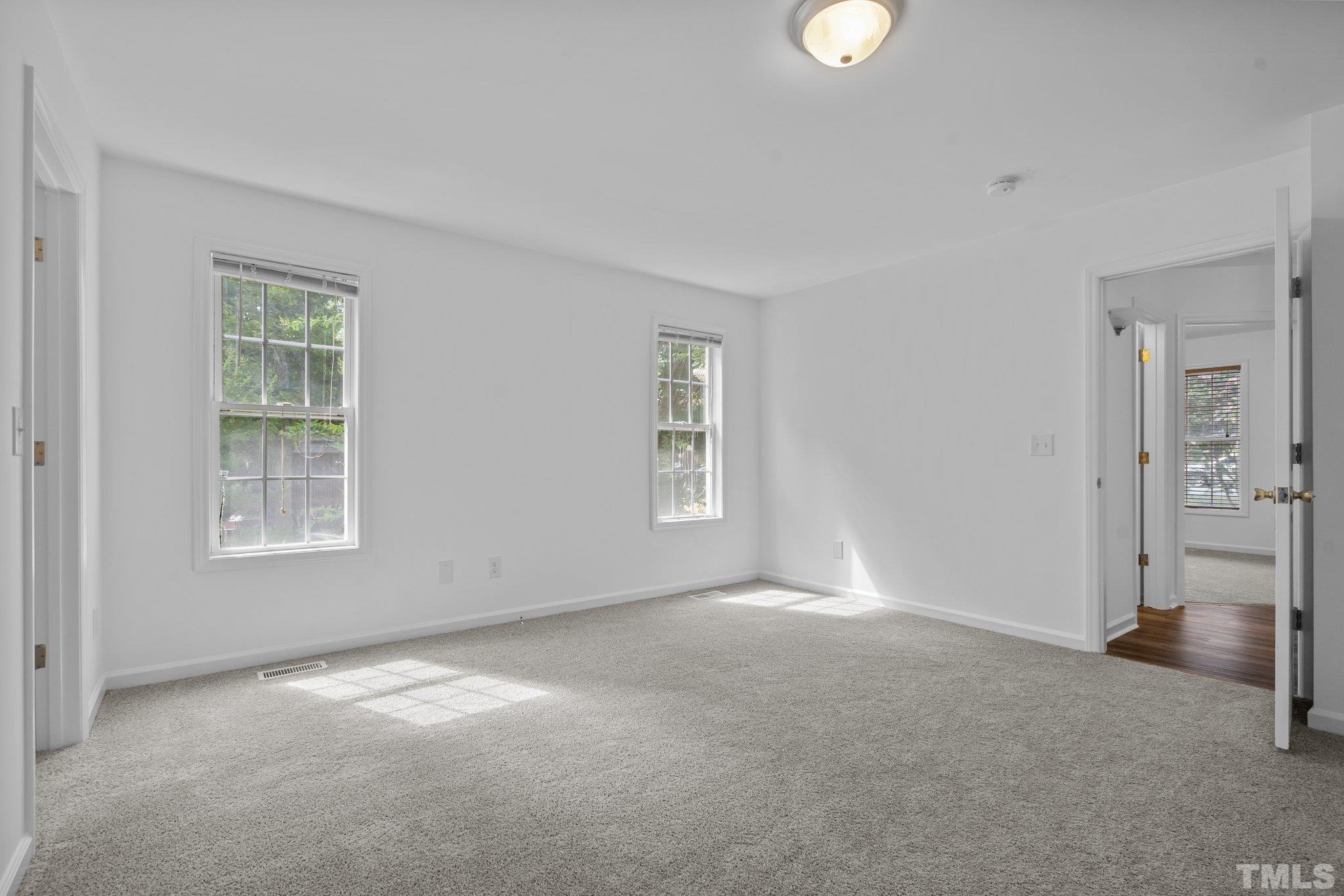 302 Laurel Drive Smithfield, NC 27577 - Photo 22 of 38 an empty room with windows and closet