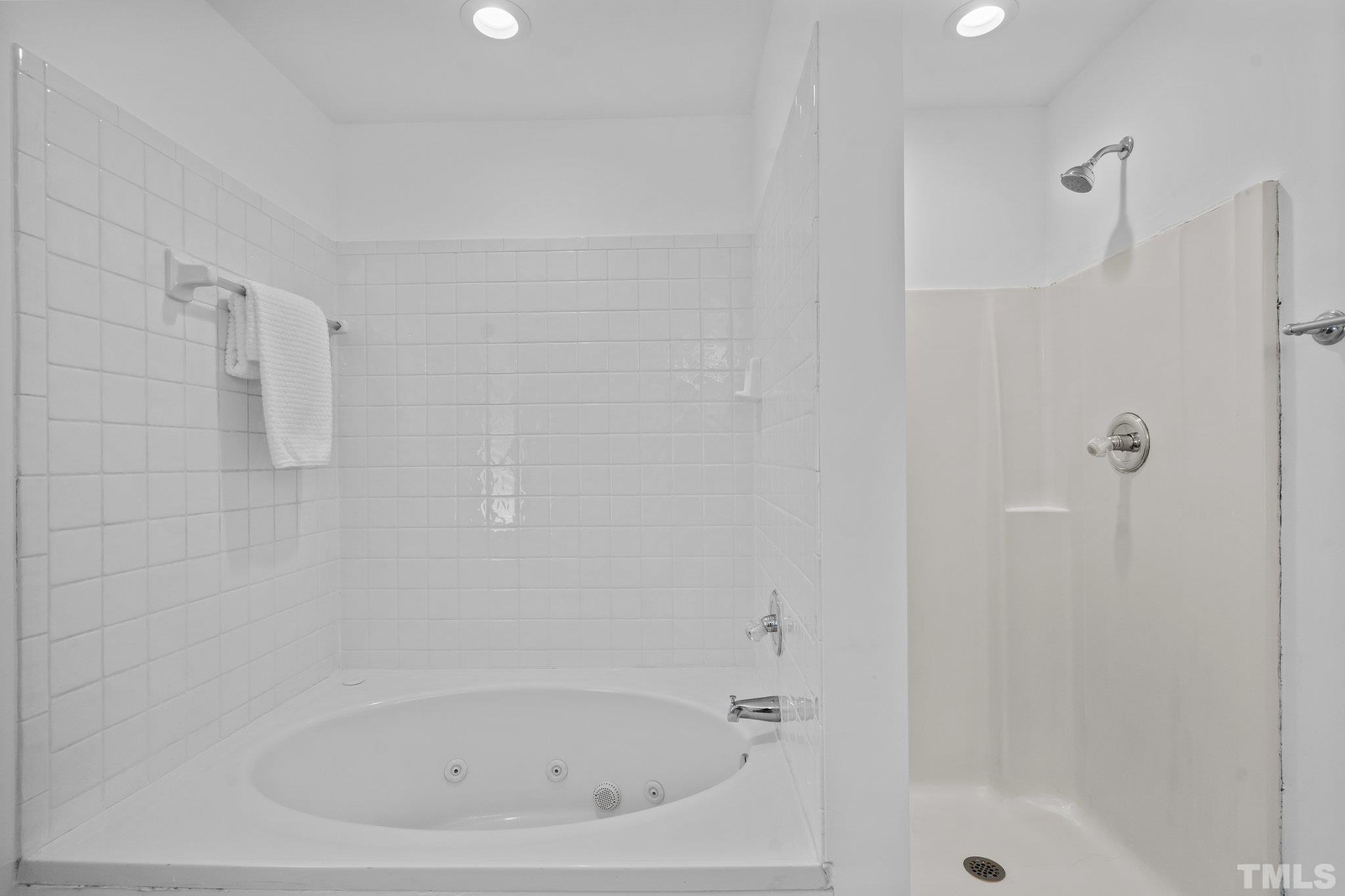 302 Laurel Drive Smithfield, NC 27577 - Photo 24 of 38 a close up of a bathtub in a bathroom