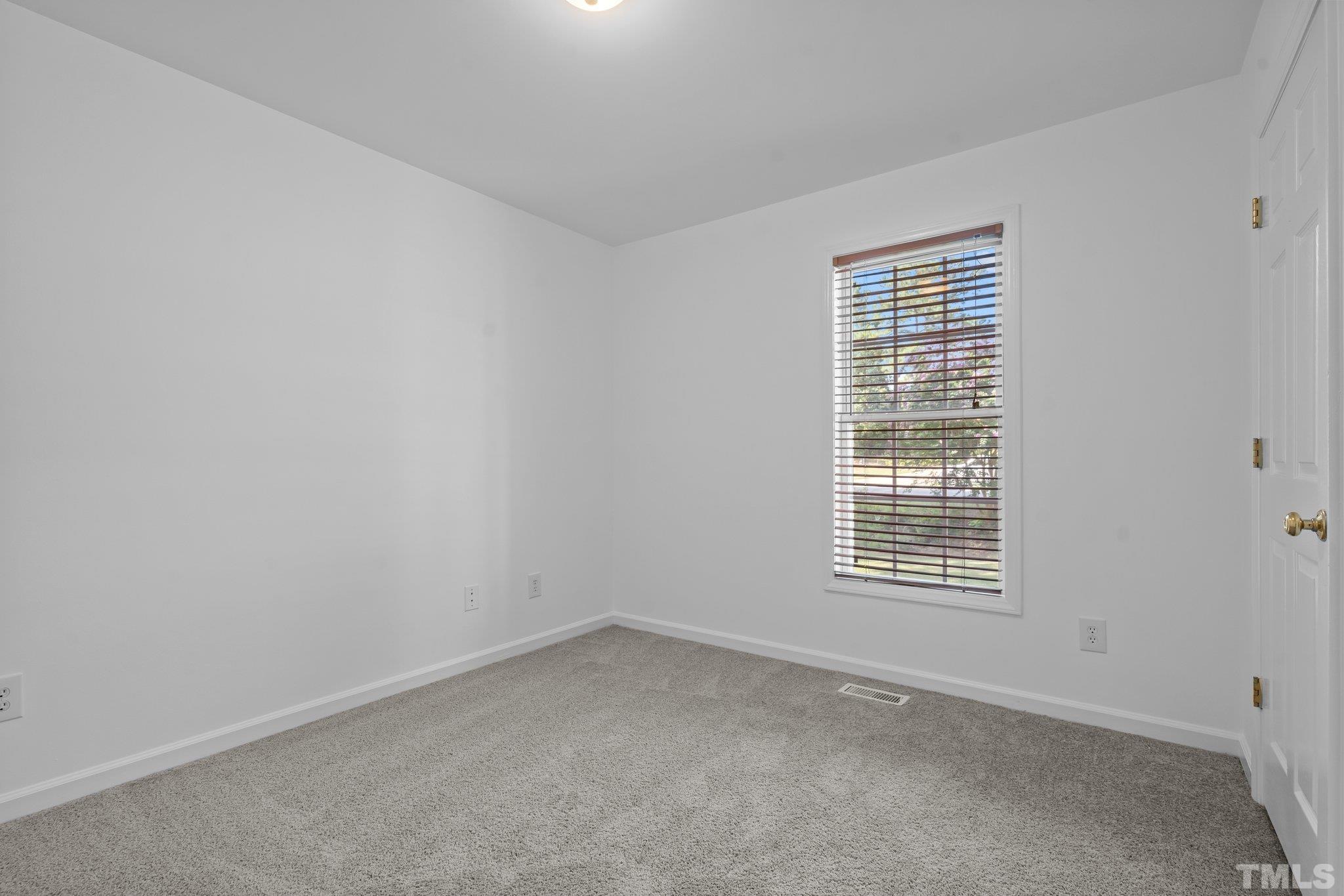 302 Laurel Drive Smithfield, NC 27577 - Photo 27 of 38 an empty room with a window