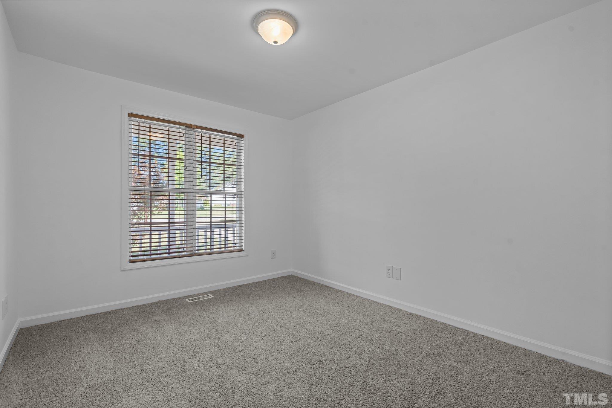302 Laurel Drive Smithfield, NC 27577 - Photo 29 of 38 an empty room with a window