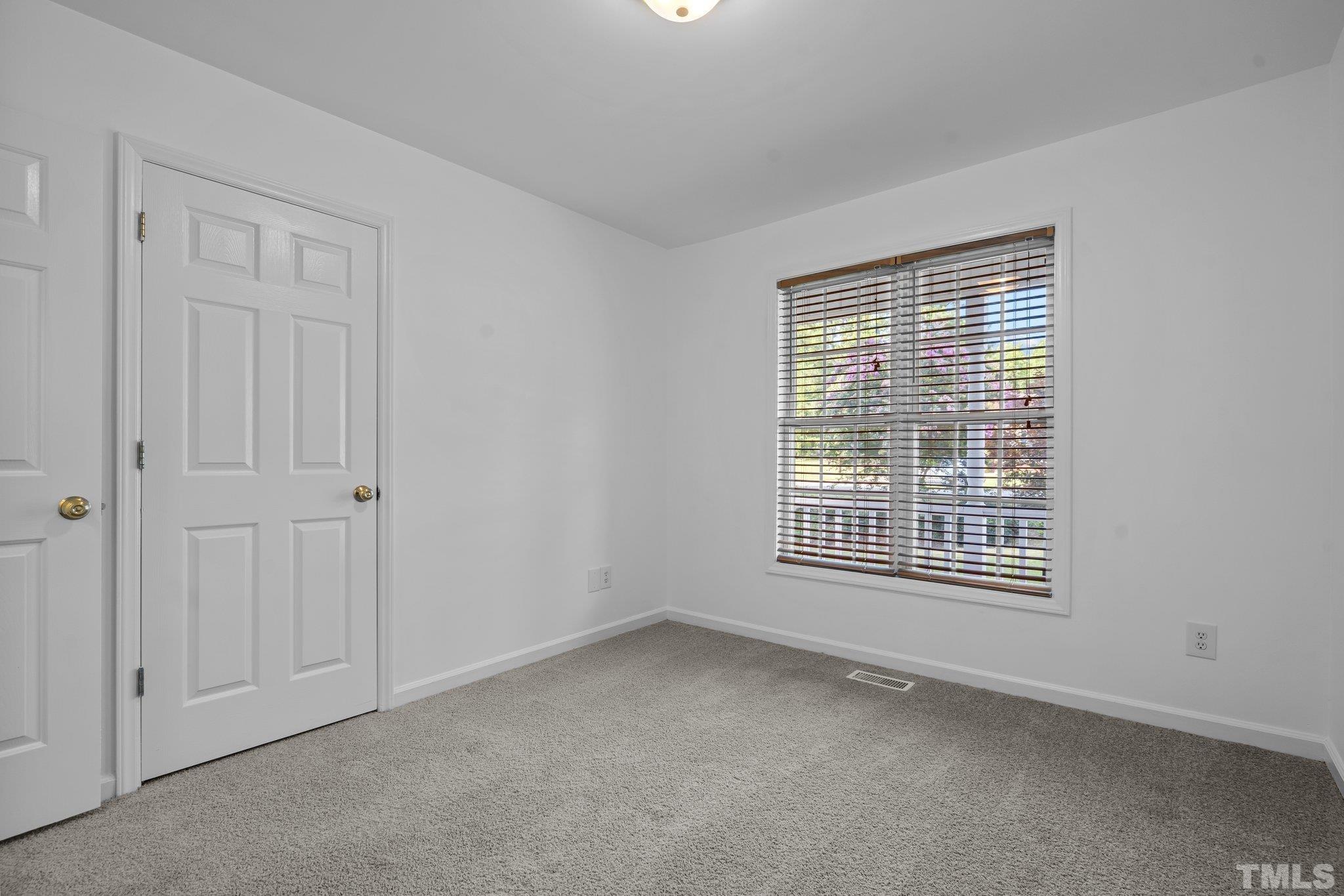 302 Laurel Drive Smithfield, NC 27577 - Photo 30 of 38 a view of an empty room with a window