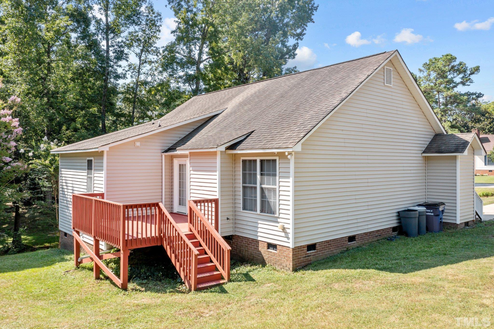 302 Laurel Drive Smithfield, NC 27577 - Photo 32 of 38 a view of a house with a yard and deck area