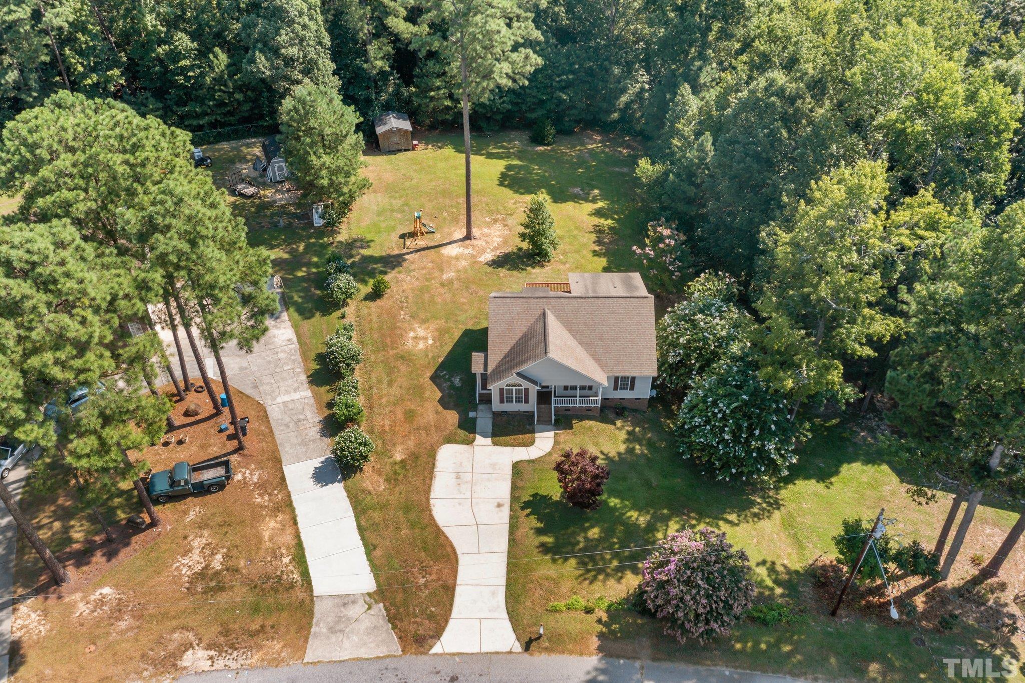 302 Laurel Drive Smithfield, NC 27577 - Photo 37 of 38 an aerial view of a house with a lake view