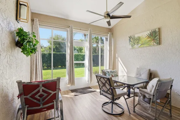 a view of a dining room with furniture window and outside view
