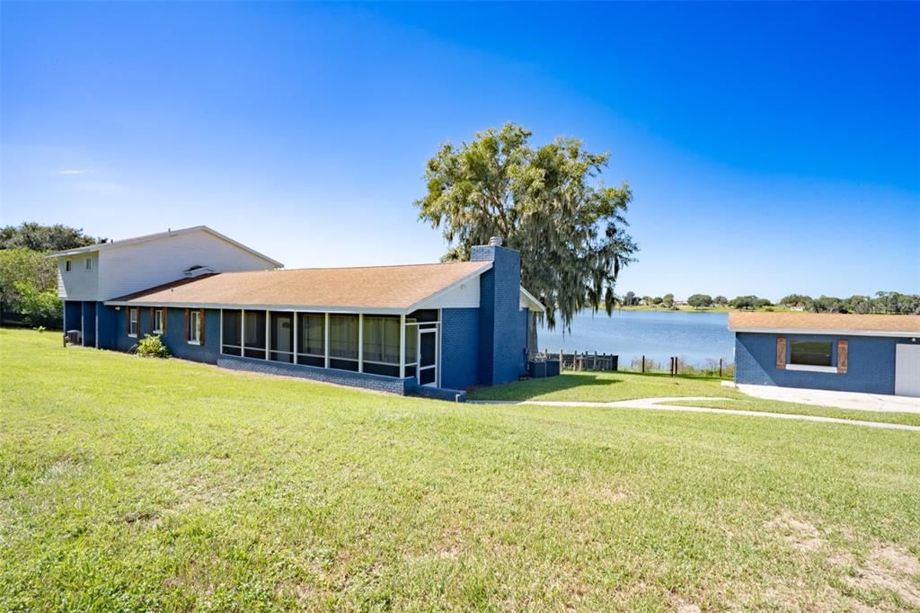 2120 Hurley Drive Bartow, FL 33830 - Photo 1 of 1 a house with swimming pool in front of it