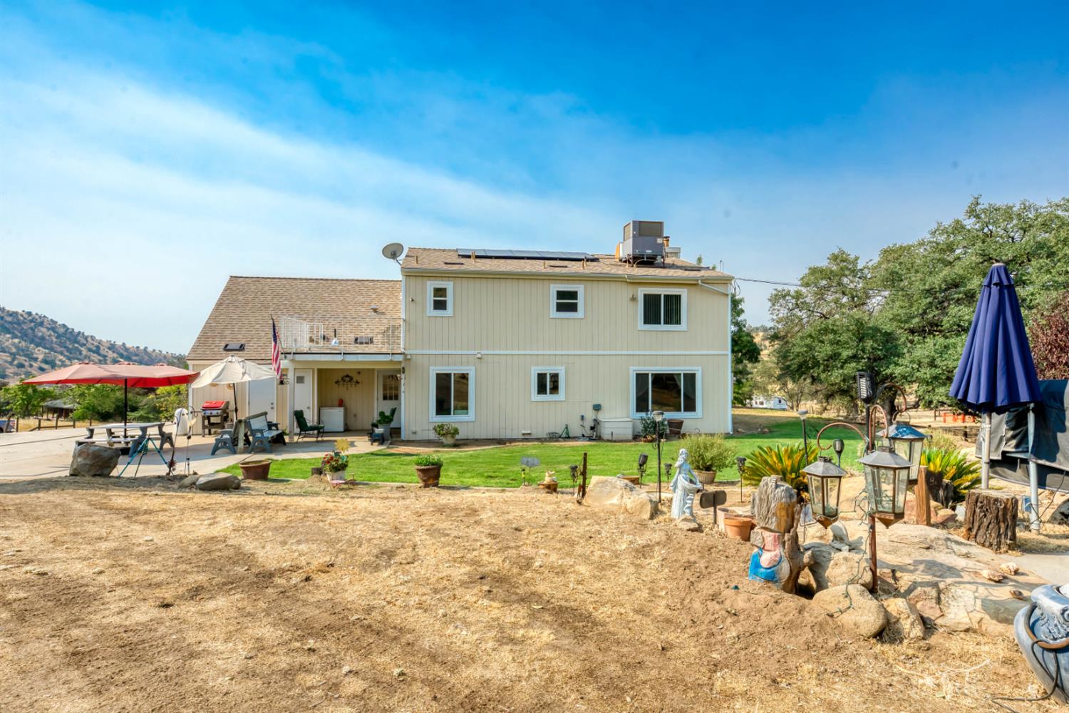15656 Millerton Road Prather, CA 93651 - Photo 11 of 56 a view of a house with a yard and sitting area