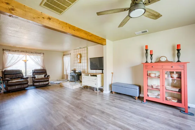 a view of an entryway with wooden floor