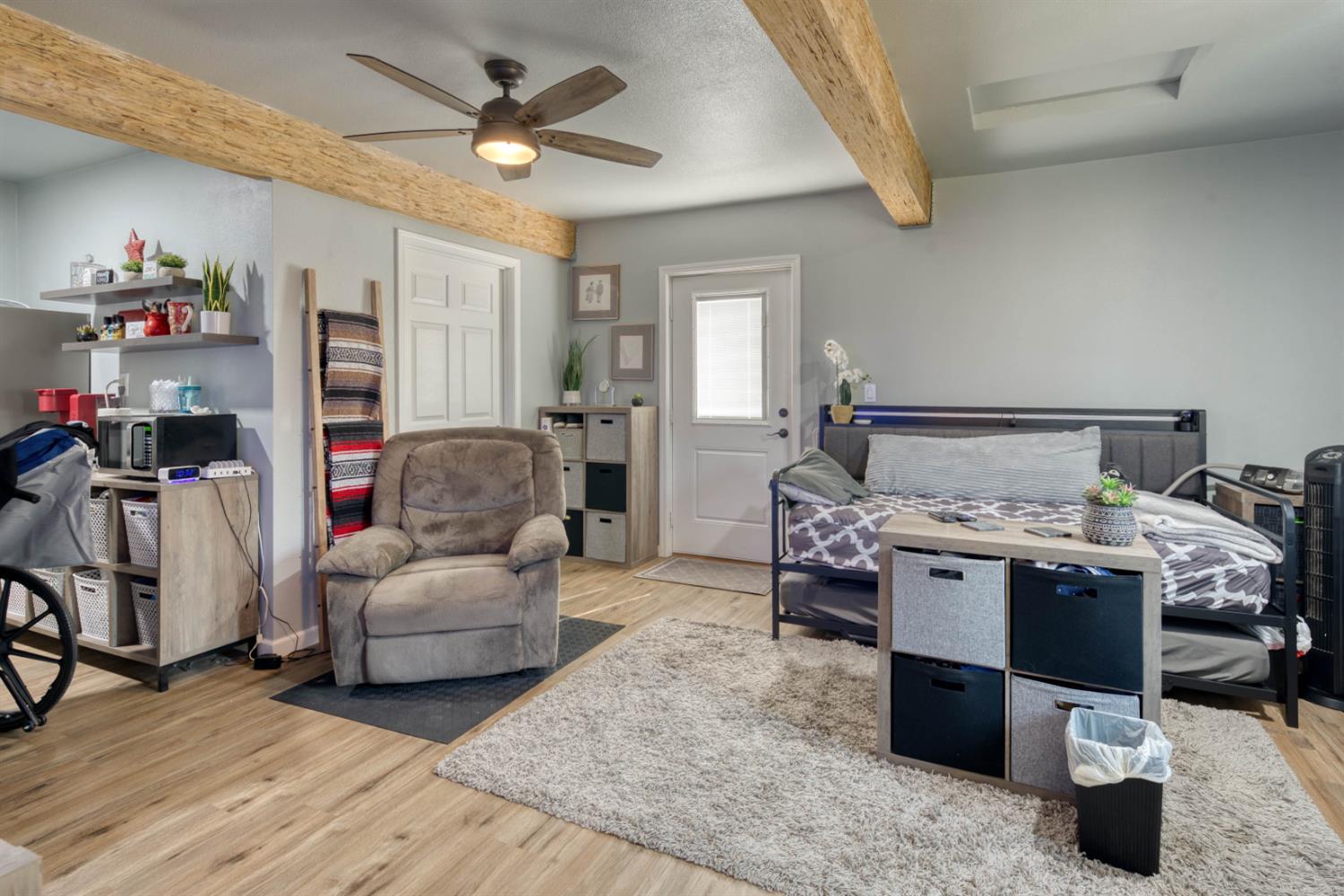 15656 Millerton Road Prather, CA 93651 - Photo 34 of 56 a bedroom with furniture and a chandelier