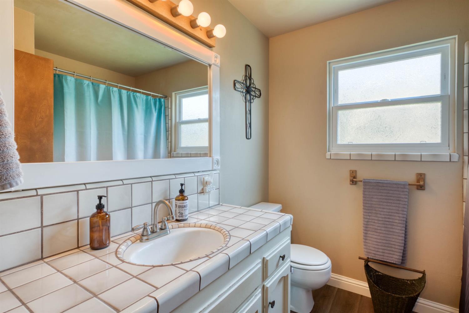 15656 Millerton Road Prather, CA 93651 - Photo 39 of 56 a bathroom with a granite countertop sink mirror vanity and toilet