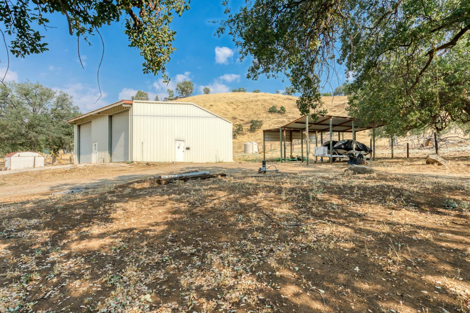 15656 Millerton Road Prather, CA 93651 - Photo 4 of 56 a front view of a house with a yard