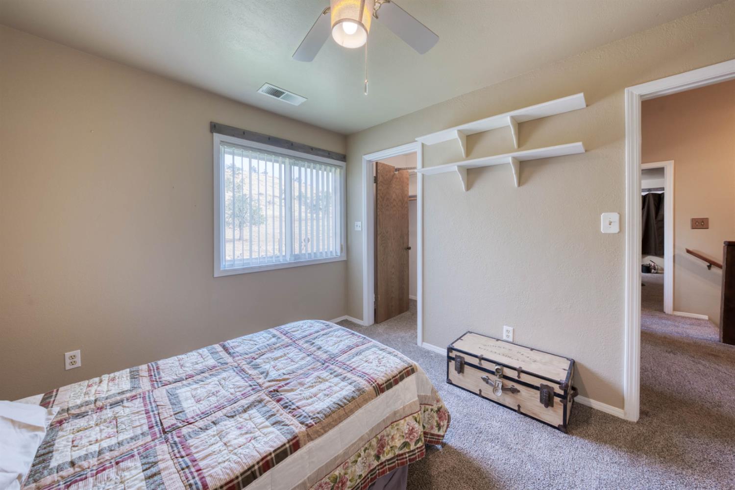 15656 Millerton Road Prather, CA 93651 - Photo 41 of 56 a bedroom with a bed and a window