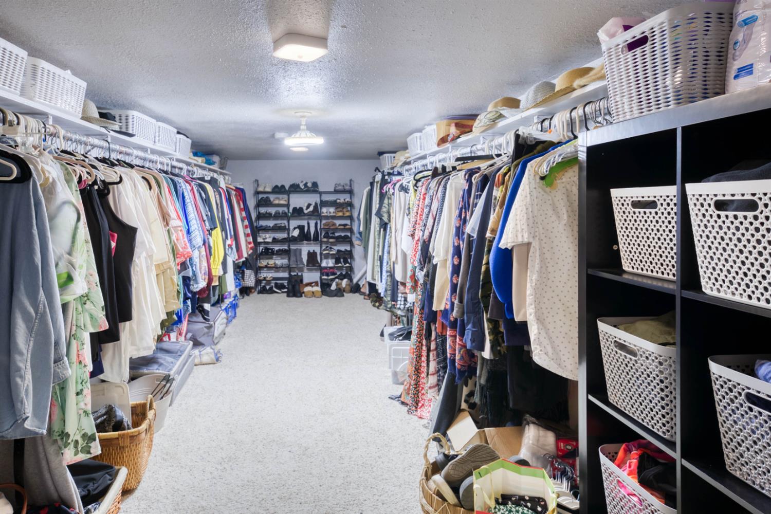 15656 Millerton Road Prather, CA 93651 - Photo 46 of 56 a view of walk in closet with clothes and shoes
