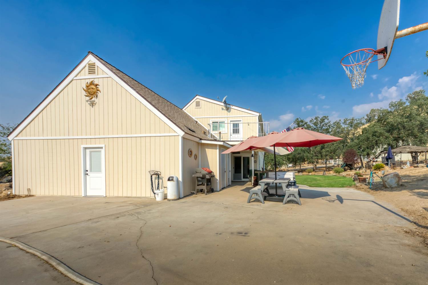15656 Millerton Road Prather, CA 93651 - Photo 10 of 56 a view of a house with a yard and sitting area