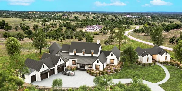 an aerial view of a house with a garden