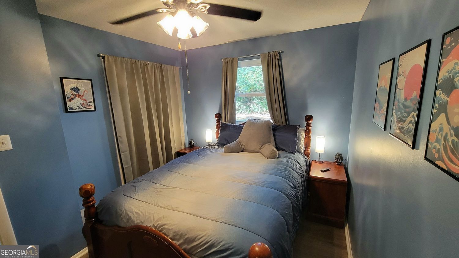 128 Wassaw Road Savannah, GA 31410 - Photo 16 of 22 a bedroom with a bed and a chandelier