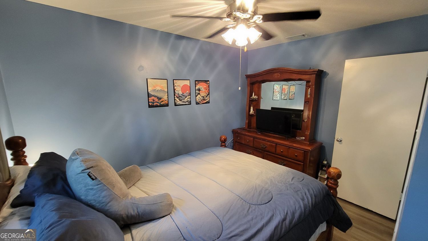 128 Wassaw Road Savannah, GA 31410 - Photo 17 of 22 a bedroom with a bed and a flat screen tv